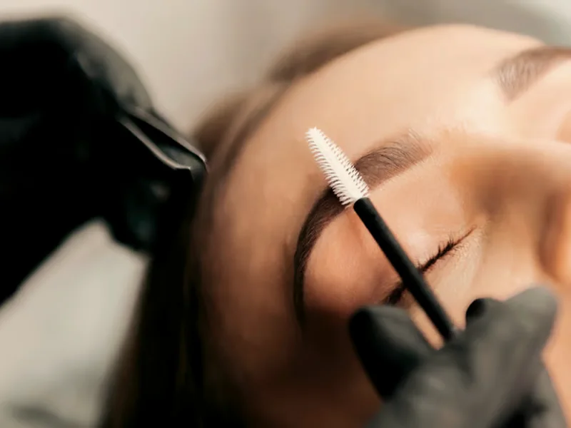 Brows groomed with a spoolie before hairstroke artistry